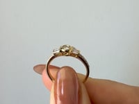 Round Bezel Diamond Ring with Tapered Baguettes