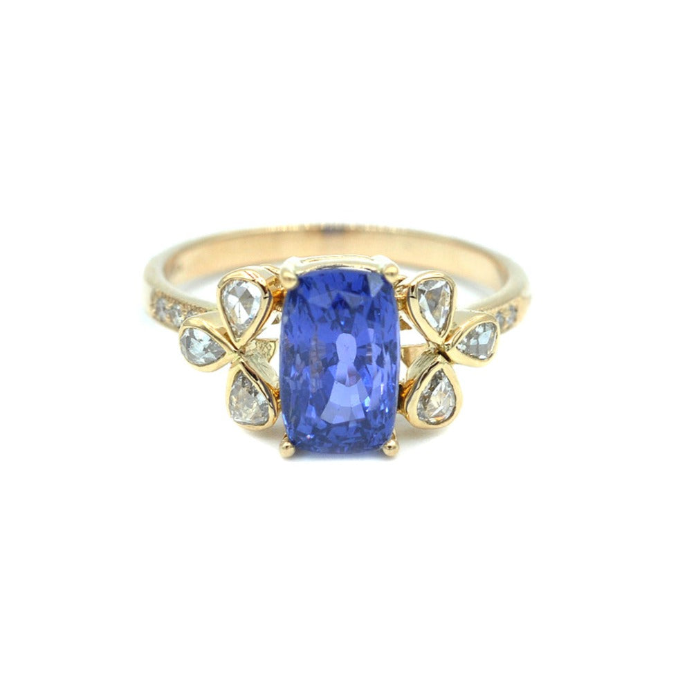 14K Blue Sapphire with Pear Shaped Side Diamonds Ring